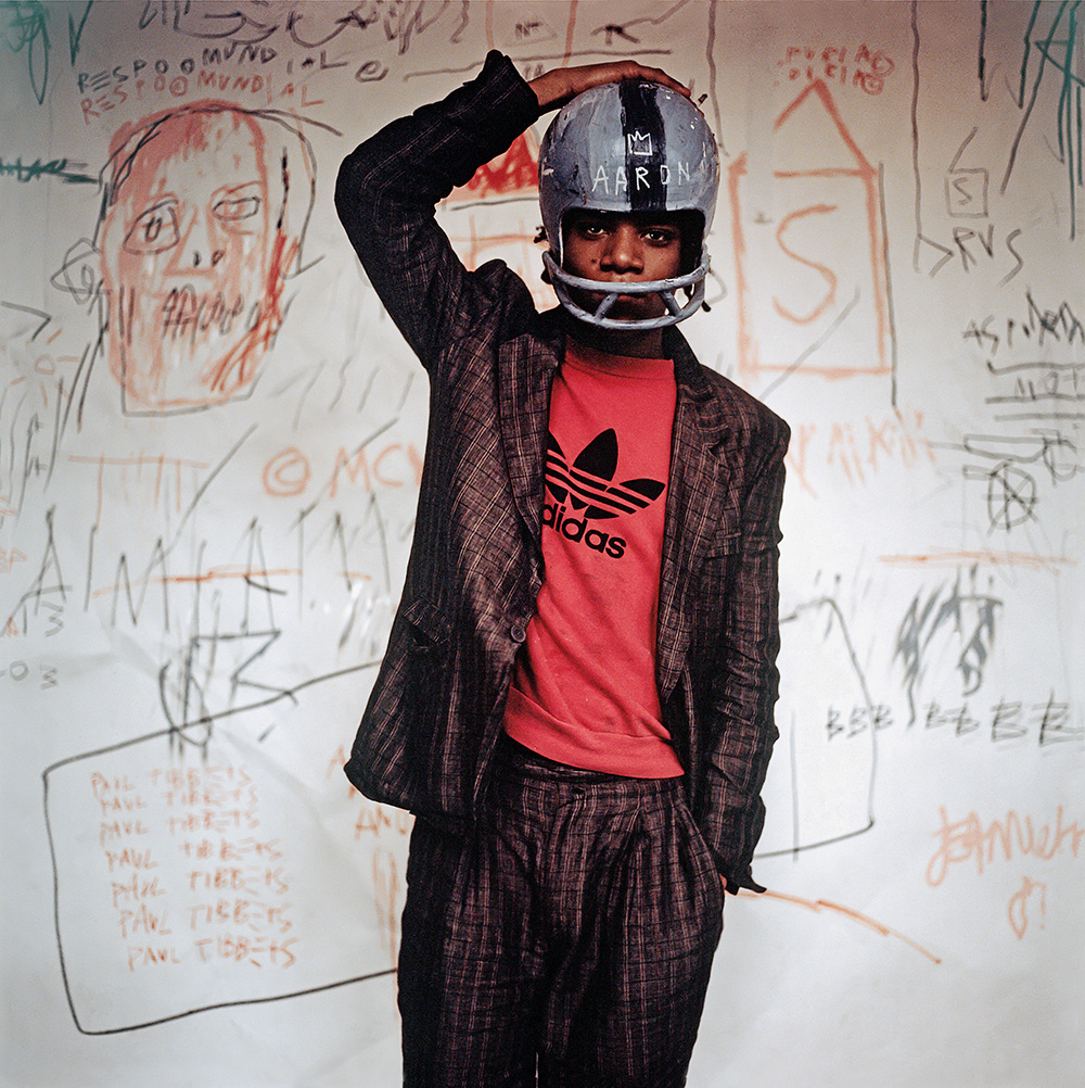 Edo Bertoglio, Jean-Michel Basquiat wearing an American football helmet, 1981, Photo: © Edo Bertoglio, courtesy of Maripol, Artwork: © VG Bild-Kunst Bonn, 2017 &amp; Estate of Jean-Michel Basquiat, Licensed by Artestar, New York
