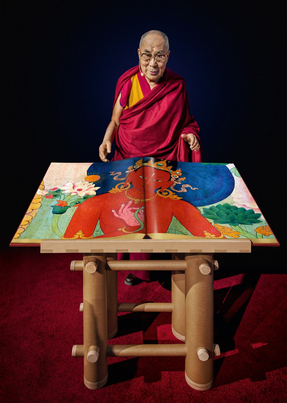 Tenzin Gyatso, the Fourteenth Dalai Lama, with a draft copy of Murals of Tibet, Boston, 2014. Copyright: Photo: Mina Magda / TASCHEN