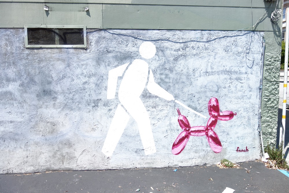 Piktogramm-Männchen mit Jeff Koons Luftballon-Hund